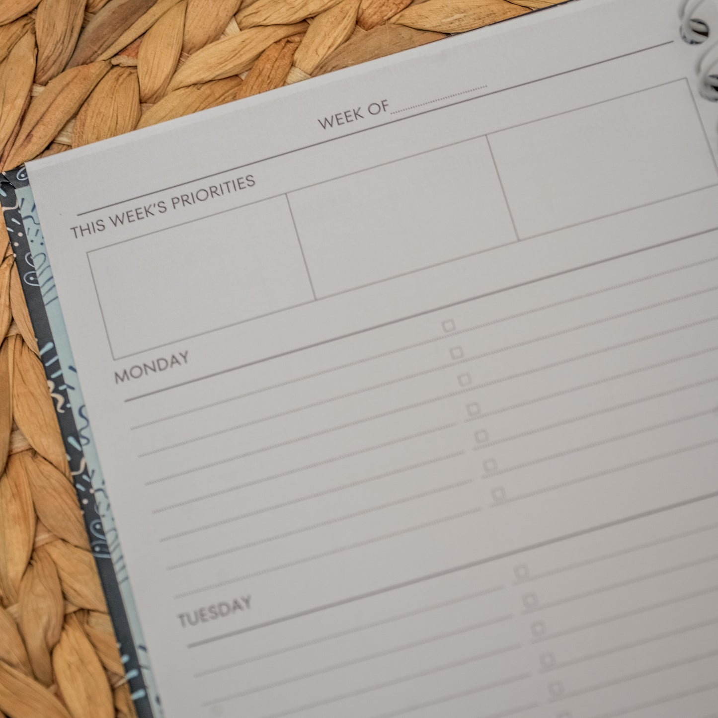 Weekly planner on a woven surface