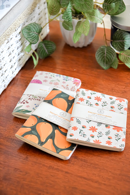 Meadow pocket sketchbook trio flat lay showing all three covers — The Art Carte