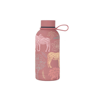 Milia insulated mini bottle styled shot on textured surface — The Art Carte