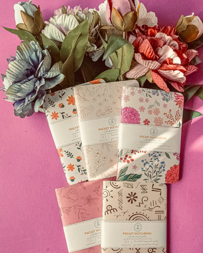 Flora pocket sketchbook trio flat lay showing all three covers — The Art Carte