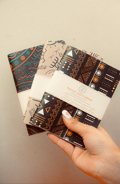 Mansa pocket sketchbook trio flat lay showing all three covers — The Art Carte