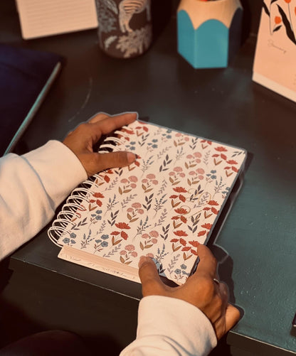 Bloom lined journal flat lay showing illustrated floral cover on white background — The Art Carte Kenya